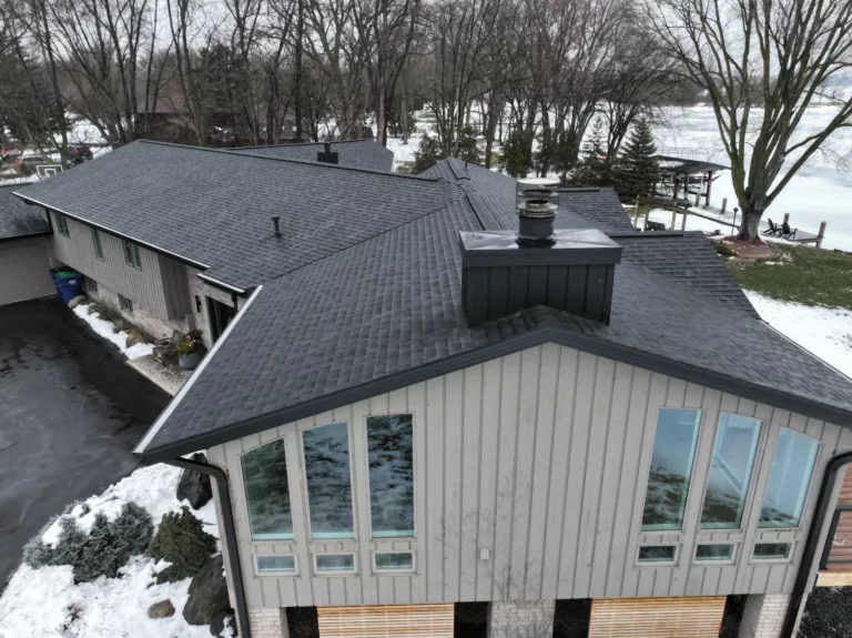 Neenah Roofing Onyx black with black chimney edge metal black fascia black soffit